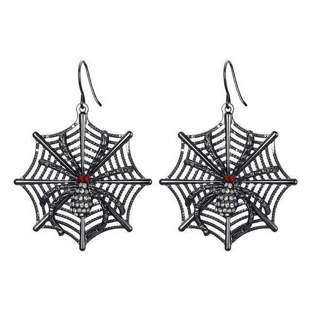 Spider web earrings with red centers on a white background