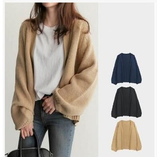 Beige cardigan worn by a person with color swatches of other cardigan colors on the right.