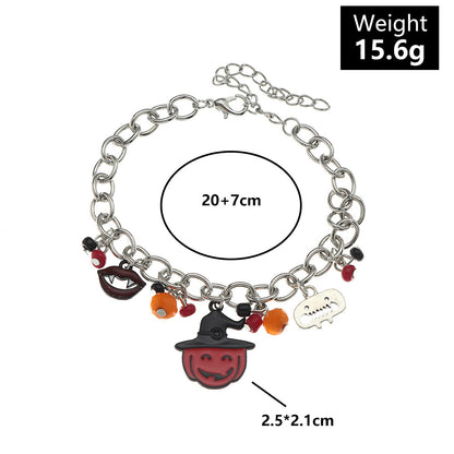 Bracelet with Halloween-themed charms on a white background