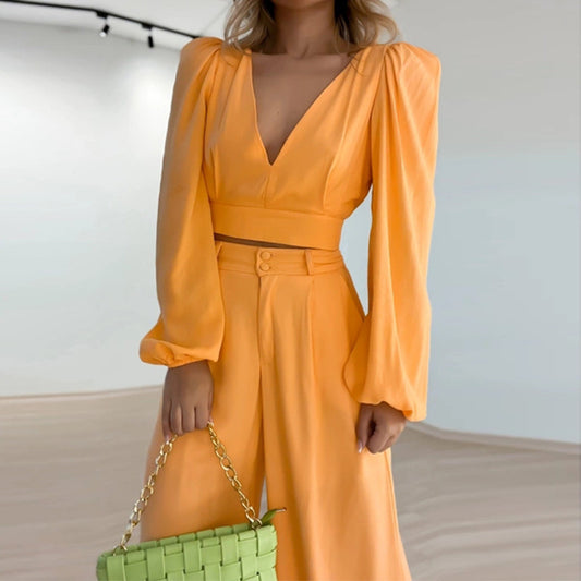 Person wearing an orange jumpsuit with a blurred background
