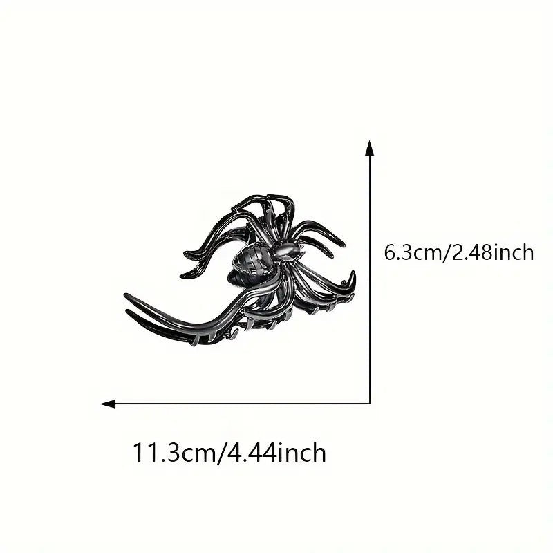 Black spider-shaped brooch with measurements on a white background