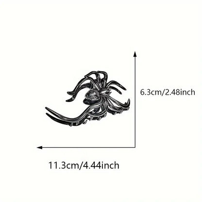 Black spider-shaped brooch with measurements on a white background