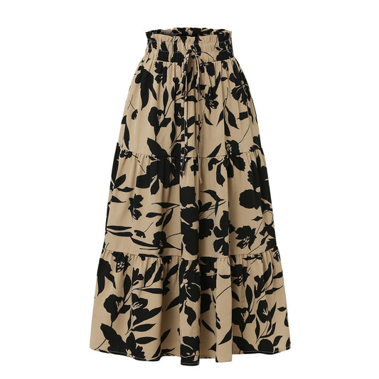 Beige skirt with black floral pattern on a white background
