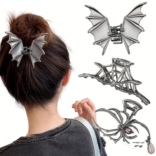 Silver bat-shaped hair clips on a person with a white background